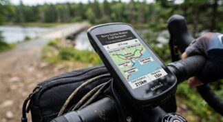 Garmin bike computer mounted on handlebars displaying the complete Nova Scotia rails-to-trails GPX map bundle, featuring the Rum Runners and Salt Marsh trails.